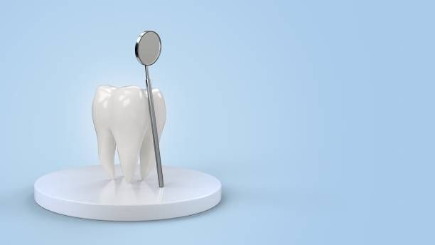 Clínica Dental Hnos. Argüello diente y espejo dental